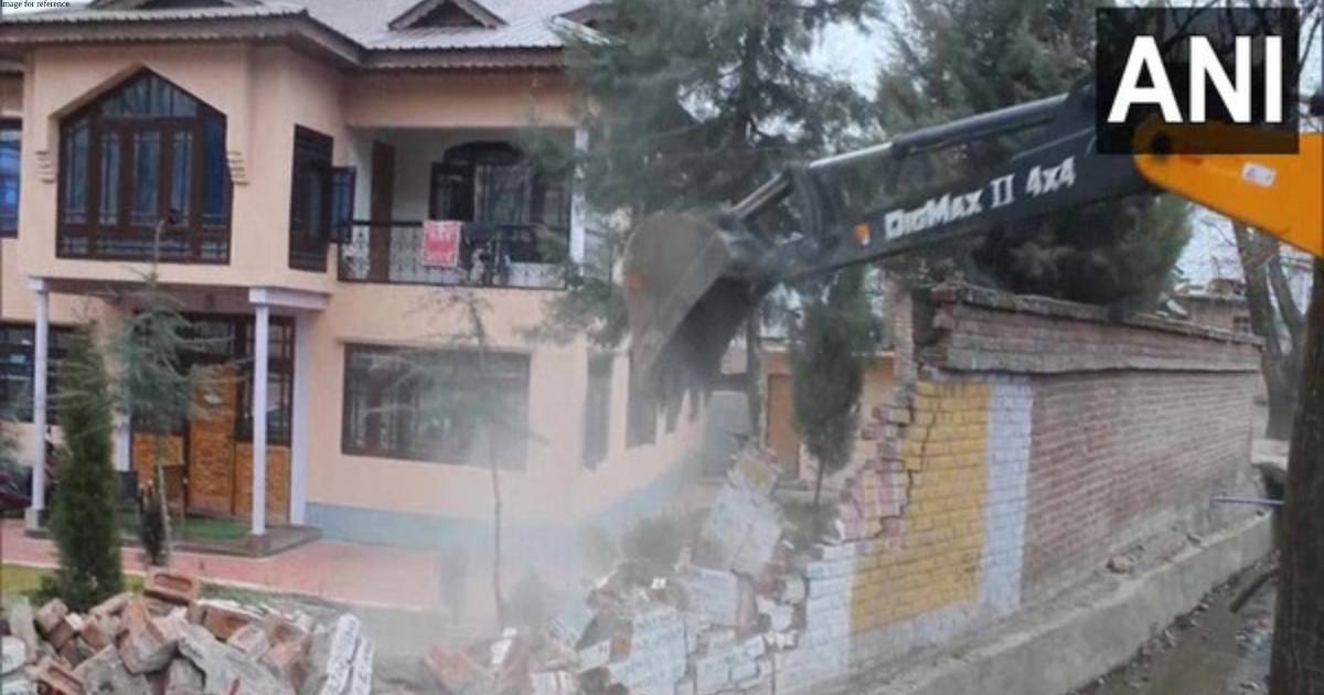 J-K: Boundary wall of Hizbul Mujahideen terrorist chief Amir Khan's house in Pahalgam razed